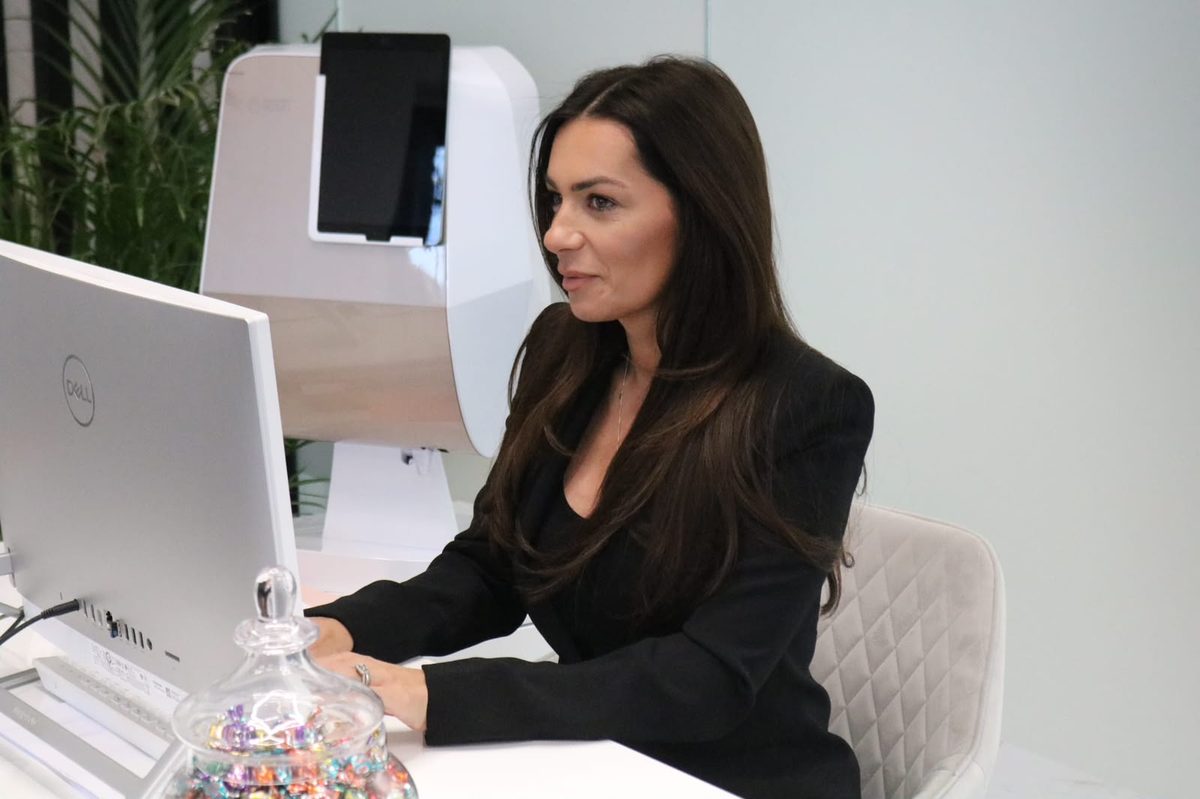 Consultation desk with skin analysis technology at KL Beauty Clinic